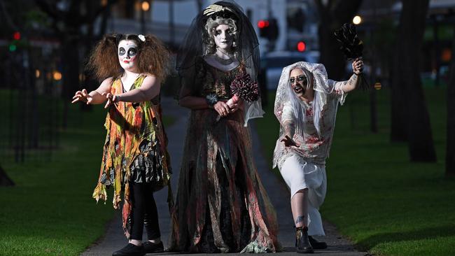 Paige Mitchell, Nicole Mitchell and Clarissa Hermann test their zombie makeup and costumes for the walk on Saturday. Picture: Tom Huntley