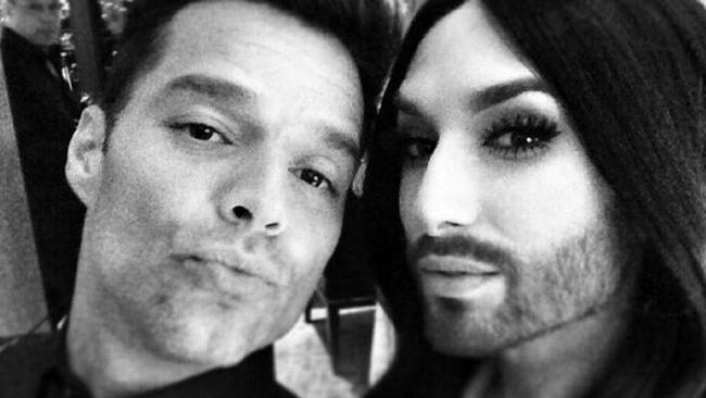 Ricky Martin works on his duck face pose with Eurovision winner Conchita Wurst.