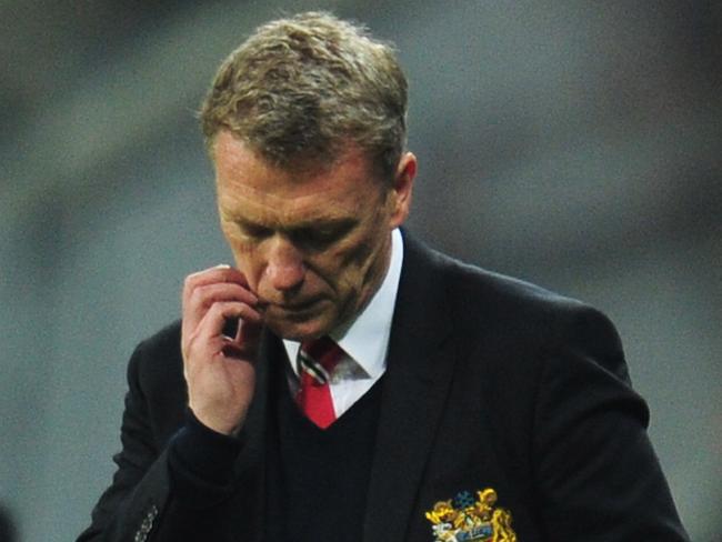 MUNICH, GERMANY - APRIL 09: David Moyes, manager of Manchester United looks dejected during the UEFA Champions League Quarter Final second leg match between FC Bayern Muenchen and Manchester United at Allianz Arena on April 9, 2014 in Munich, Germany. (Photo by Shaun Botterill/Getty Images)