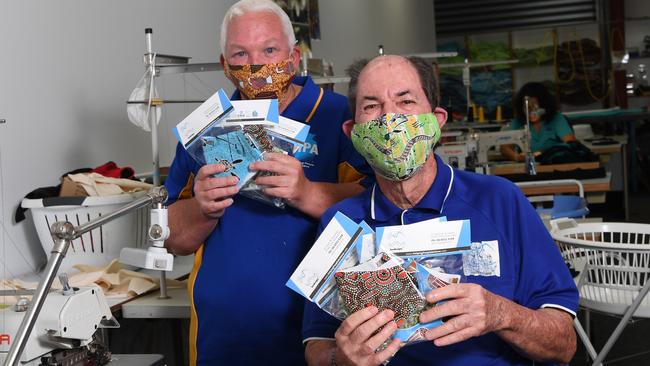 Graham MacIntosh and Raymond Walker show off the masks they made. Picture: Katrina Bridgeford.