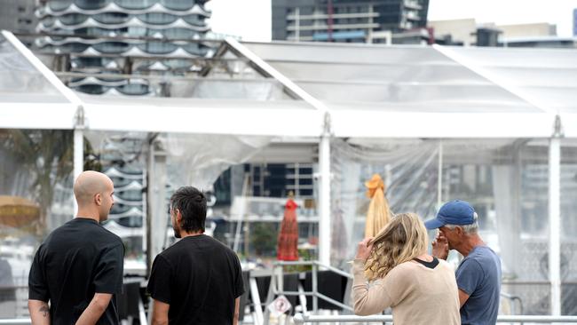 Owners and staff gather at ATET floating nightclub at North Wharf after the venue was damaged by an overnight fire. Picture: NCA NewsWire / Andrew Henshaw