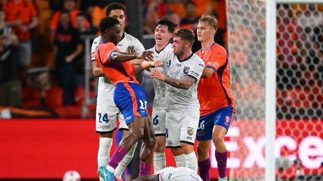 Roar defender Hosine Bility (left) and Mariners players clash during Central Coast’s 3-1 win at Suncorp Stadium. Picture: Matt Roberts/Getty Images