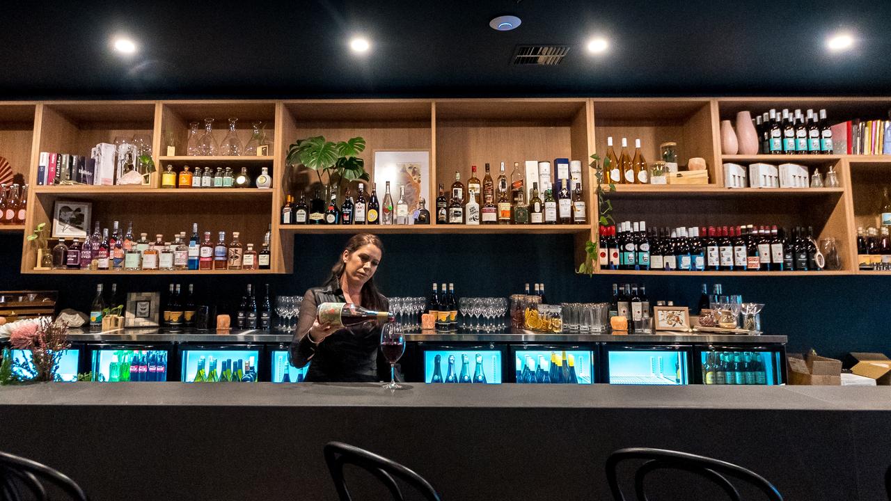 Micha Whitley behind the bar at Cork and Lever.