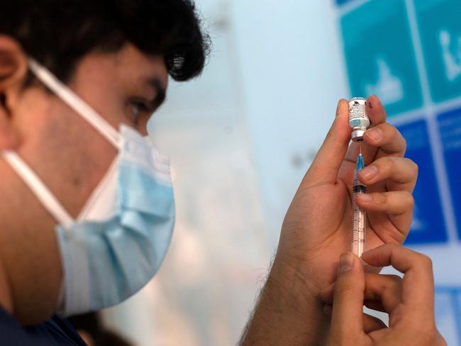 A nurse fills a syringe with the Pfizer COVID-19 vaccine. Picture: Claudio Reyes/AFP