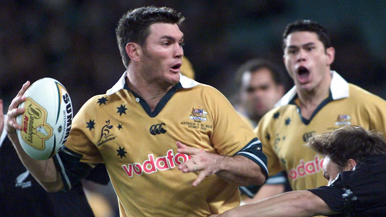 Former Wallaby Daniel Herbert with hooker Jeremy Paul screaming in support.