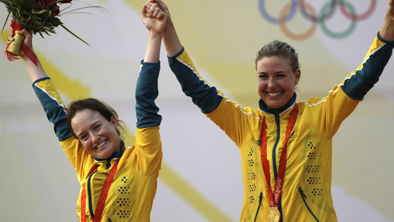 Elise Rechichi, left, and Tess Parkinson, after winning their gold medal at the 2008 Olympics.