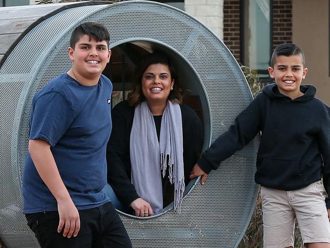 Research from ANU has shown living within 300m of a park can increase the property value of real estate by $32,000. Jaclyn Cremona with her sons Ashton 12yrs and Leon 10yrs in the park opposite their house in the outer western suburb of Aintree. Picture : Ian Currie