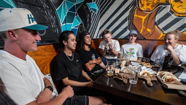 Monthly dinners have helped the young men through some dark times. Picture shows the friends, now in their 20’s, at Modus Brewing in Mona Vale. Pictured (L-R) are: Sam Lock (21) Nick Llamas (20) Johan Fetlaar (22) Josh Banning (23) Jacob Coster (21) Justene Gordon from The Burdekin Association. Pictures by Julian Andrews.