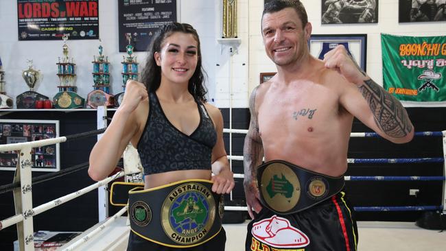 Jasmine Parr and her dad John Wayne Parr with their belts at Boonchu gym at West Burleigh. Picture Glenn Hampson