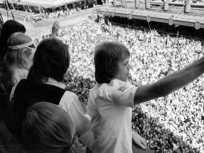 The Visitors: ABBA wave to fans from the balcony of Melbourne Town Hall in March 1977.