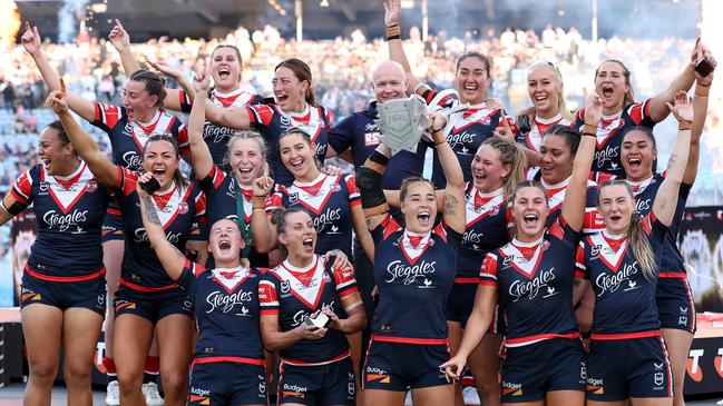 SYDNEY, AUSTRALIA - OCTOBER 06:  Roosters players celebrate with the NRL Women's Premiership Trophy after winning the NRLW Grand Final match between Sydney Roosters and Cronulla Sharks at Accor Stadium on October 06, 2024, in Sydney, Australia. (Photo by Cameron Spencer/Getty Images)