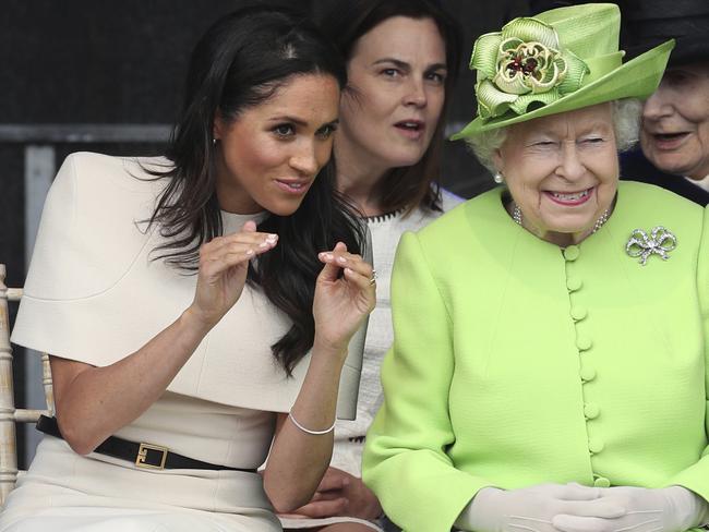 Britain's Queen Elizabeth and Meghan, the Duchess of Sussex, left, attend the opening of the new Mersey Gateway Bridge, in Widnes, north west England, Thursday June 14, 2018. (Danny Lawson/PA via AP)