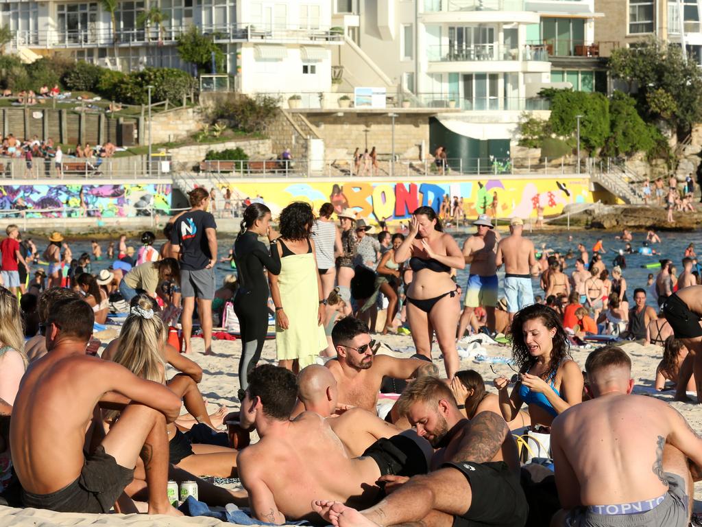 Beachgoers are seen at Bondi Beach despite the threat of coronavirus (COVID-19) in Sydney, Friday. Picture: John Fotiadis