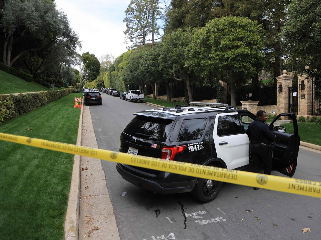 Police cars are seen behind caution tape outside the home of Sean Combs in Los Angeles. Picture: AFP