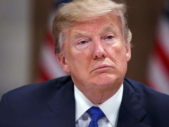 Mr Trump listens during a dinner with European business leaders at the World Economic Forum in Davos yesterday. Picture: Evan Vucci/AP