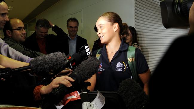 Barty arrives home to waiting media at Brisbane Airport after her Wimbledon victory.