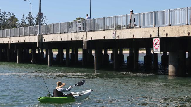 Cleaning up the beach and waterways near Tallebudgera Creek, as part of an effort to minimise harm to the environment. Picture Glenn Hampson