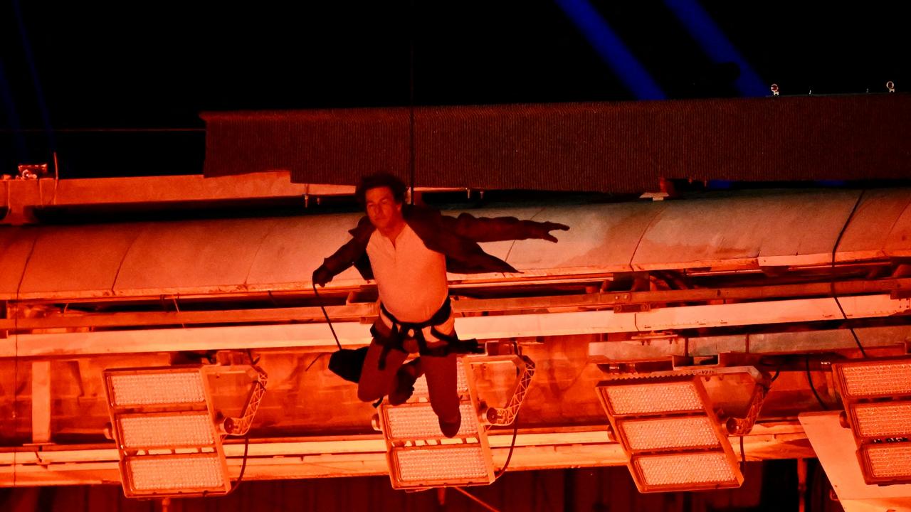 The soaring heights set by the Paris Games were literal for Tom Cruise, who leapt from the roof of Stade de France during the ceremony. Picture: Andy Chua-Pool/Getty Images