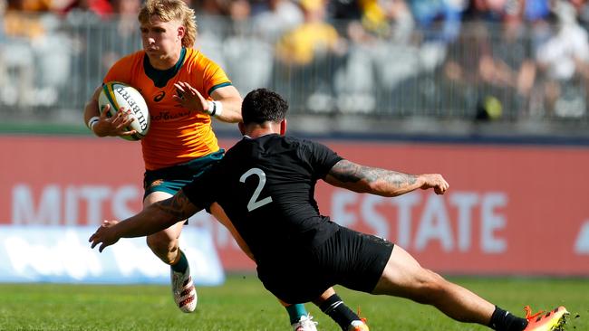 Tate McDermott of the Wallabies evades the tackle from Codie Taylor of the All Blacks during the Bledisloe Cup match between the Australian Wallabies and the New Zealand All Blacks, part of The Rugby Championship, at Optus Stadium on September 05, 2021 in Perth, Australia. (Photo by James Worsfold/Getty Images)