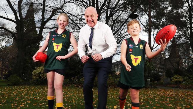 Premier Peter Gutwein with siblings Emily Apted 13 and Bailey Apted 8 of Midway Point. Inspiring passion for Tassie footy ahead of the AFL game at Blundstone Arena. Picture: Nikki Davis-Jones