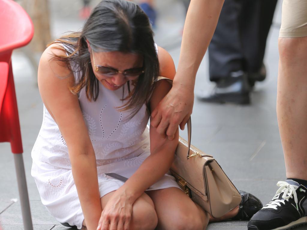 Vivian Vo breaks down in tears outside the Happy Cup cafe in Bankstown where Ho Ledinh was murdered. Picture: John Grainger.