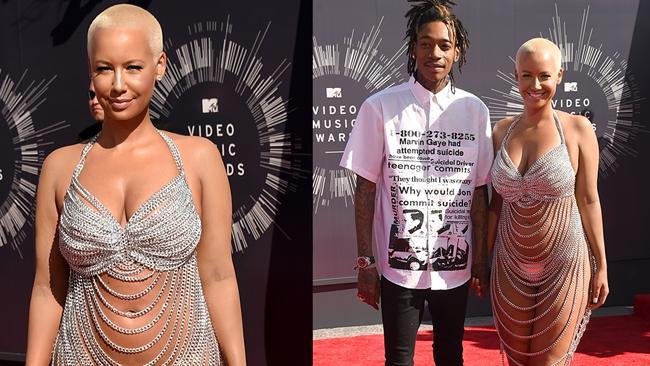 Amber Rose and partner rapper Wiz Khalifa walk the red carpet at the 2014 Video Music Awards, the VMAs. Picture: Getty