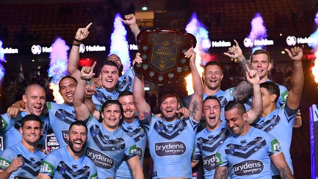 NSW players celebrate winning the 2018 State of Origin series between the NSW Blues and the Queensland Maroons at Suncorp Stadium in Brisbane, Wednesday, July 11, 2018. (AAP Image/Darren England) NO ARCHIVING, EDITORIAL USE ONLY