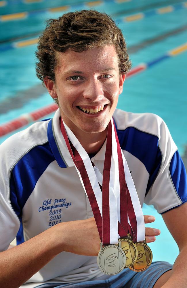 Jack Cartwright, 15, with the two gold and one silver medal he won at the Queensland titles.