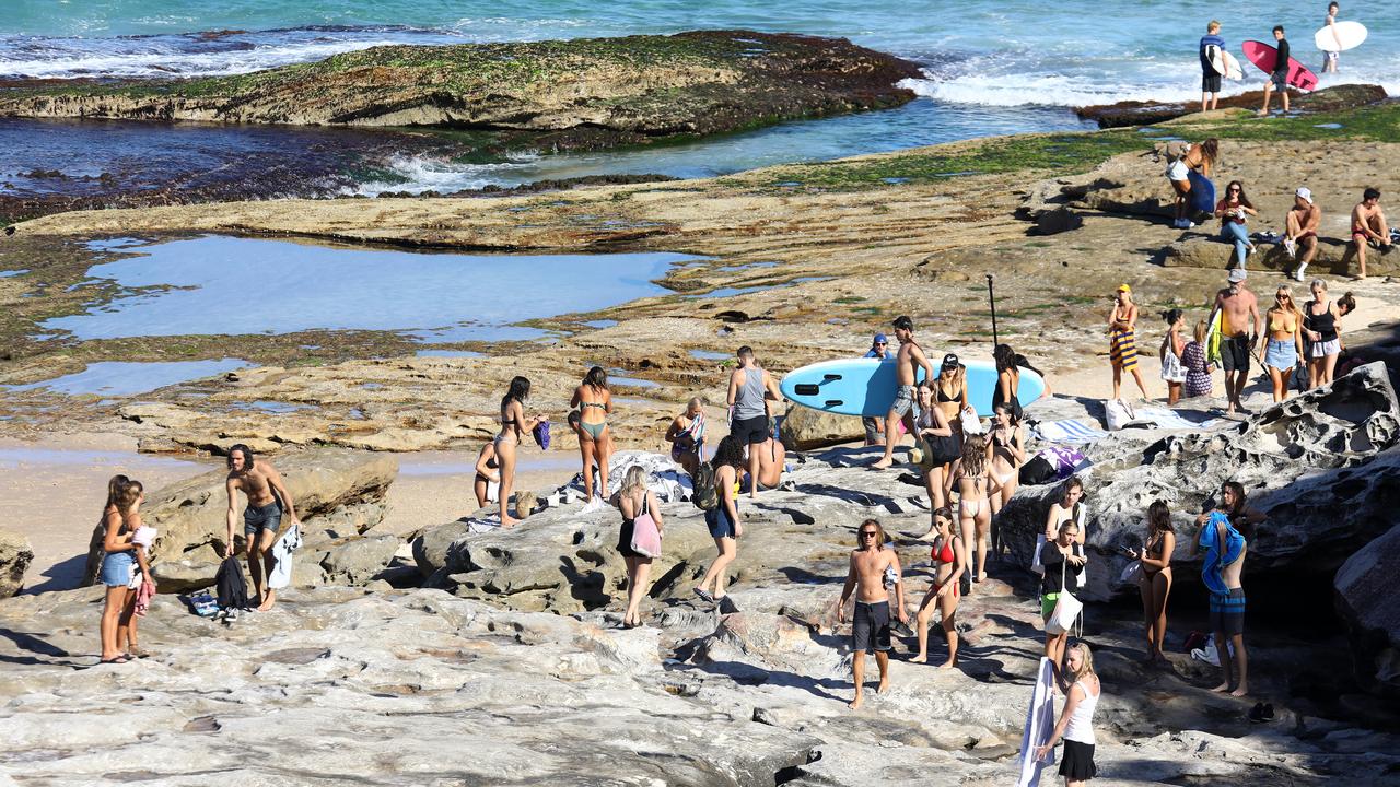 The crowd on Saturday was a combination of surfers, swimmers and sunbathers. Picture: Matrix