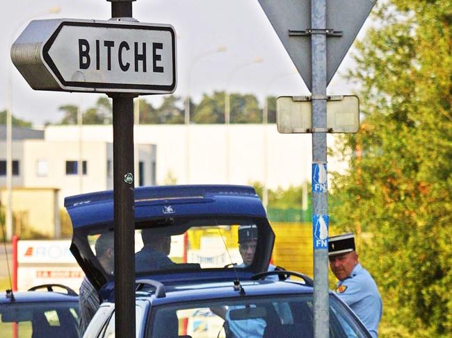 (FILES) In this file photograph taken on June 20, 2002, French gendarmes stand near a sign for the town of Bitche, Moselle Region, eastern France - The French town of Bitche celebrated its return to Facebook on April 13, 2021, three weeks after censors took down its page, believing the name to be an insult. The mayor of the northeastern town of 5,000 inhabitants, near the border with Germany, said that Facebook took down the page on March 19 on the basis that Bitche was a "violation of the conditions applying to Facebook pages". (Photo by THOMAS WIRTH / AFP)