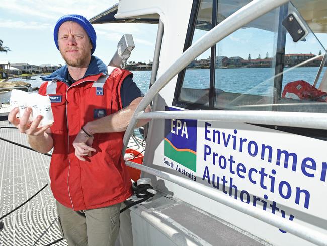 26/08/20 - EPA Principal scientific office (Marine) Sam Gaylard with water samples taken from West Lakes.Picture: Tom Huntley