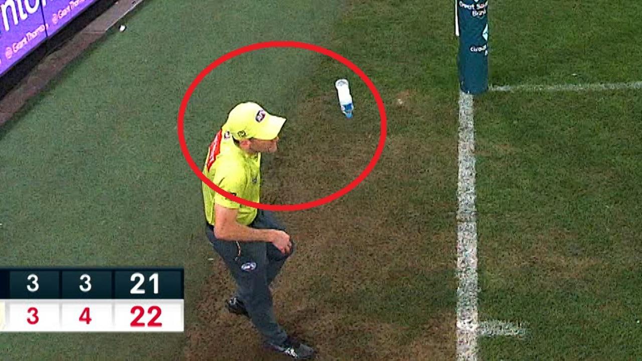 A goal umpire was hit by a water bottle.