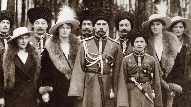 Tsar Nicholas II and his five children with Cossacks in 1916. Picture: Beinecke Library, Yale University.