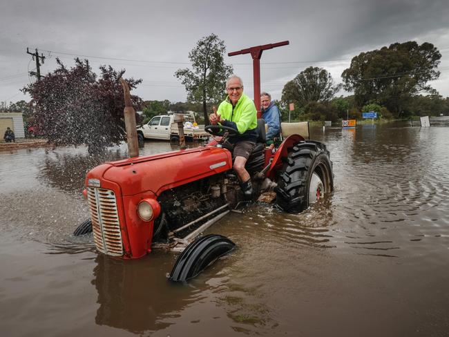 Tractors and boats are favoured forms of transport through Echuca’s flood waters. Picture: David Caird