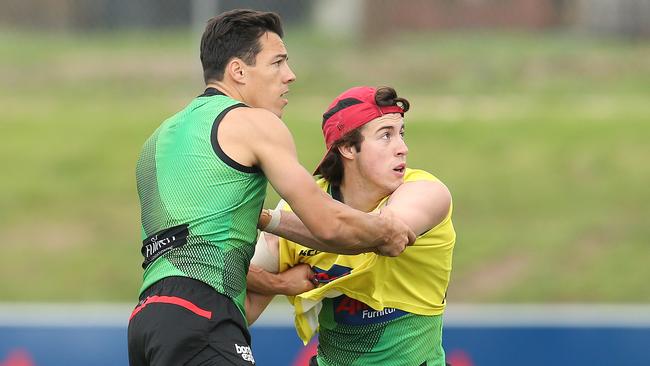 New Bomber Dylan Shiel battles with Andrew McGrath during the pre-season.