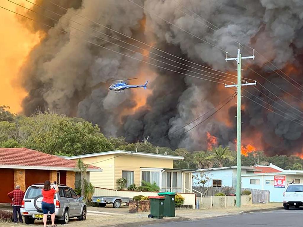 A residential area is threatened by flames northeast of Sydney. Picture: Kelly-Ann Oosterbeek