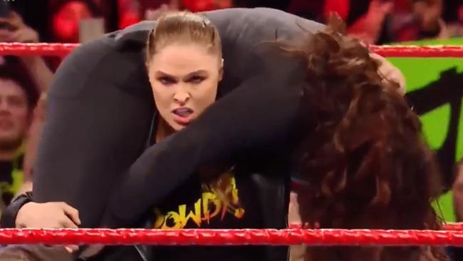 Ronda Rousey prepares to drop Stephanie McMahon.