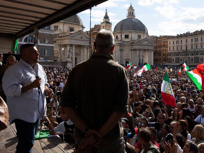 Leader in Rome of far-right party Forza Nuova, Giuliano Castellino (L) speaks on stage on Piazza del Popolo during a protest against the mandatory "green pass". Picture: AFP