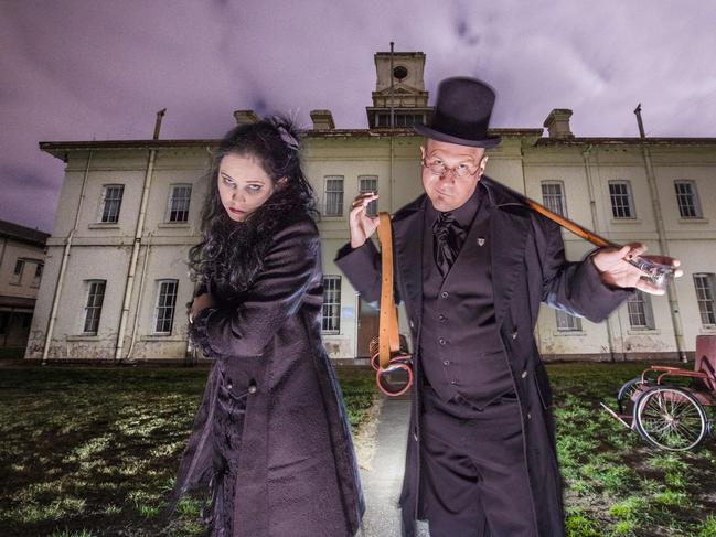 ‘The maddest place in the world’ ... tour guides Annie Sienesi and Nathaniel Buchanan pose for the camera at Aradale Asylum. What some of their guests experience is less amusing.