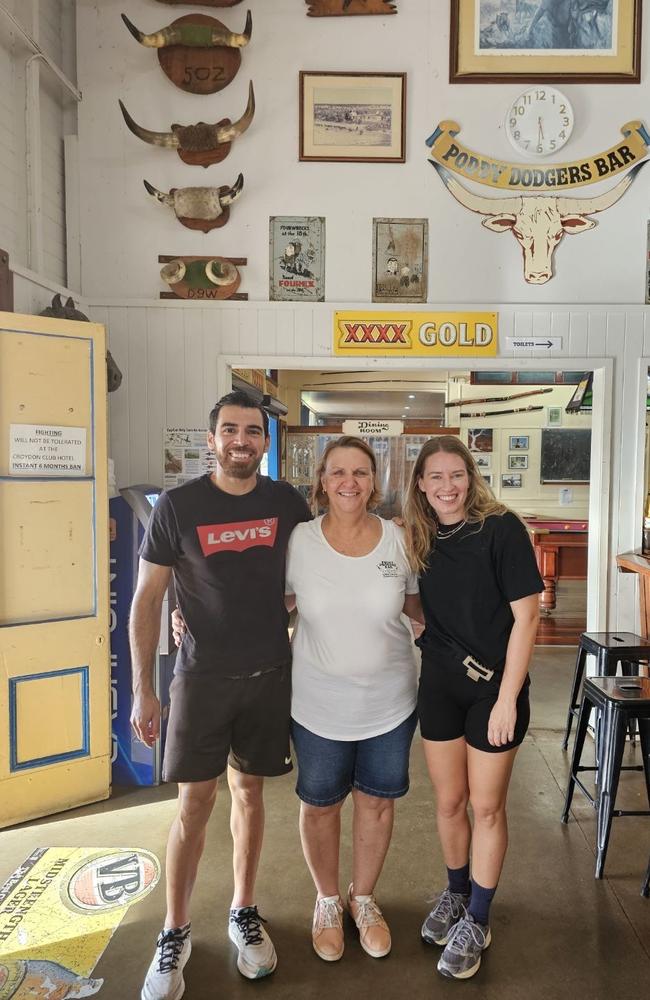 Club Hotel Croydon owner Eva Garde (centre) with backpackers working at the venue. Photo: Supplied