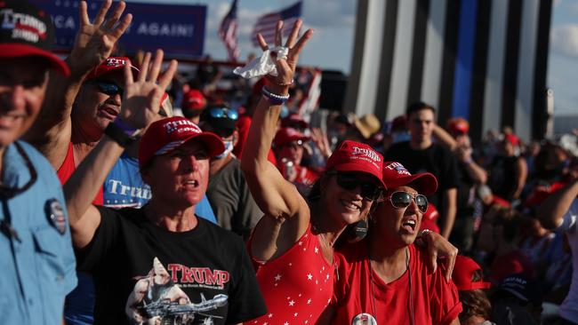 Trump supporters wait for the start of his campaign rally in Florida. Picture: AFP.