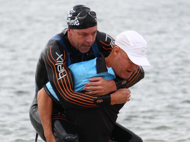 Bill Chaffey gets a helping hand at the Luke Harrop Memorial Triathlon. Picture: Kit Wise