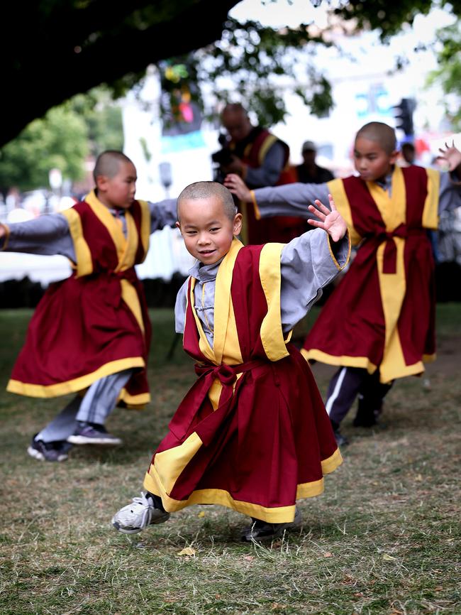 Young Living Buddhas perfoming Buddhist meditation on Parliament House Lawns. Pictures: SAM ROSEWARNE