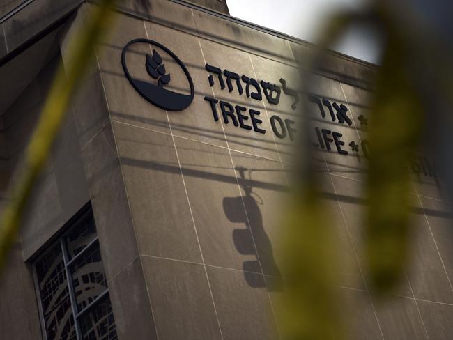 Police tape is seen on October 28, 2018 outside the Tree of Life Synagogue after a shooting there left 11 people dead in the Squirrel Hill neighborhood of Pittsburgh on October 27, 2018. - A man suspected of bursting into a Pittsburgh synagogue during a baby-naming ceremony and gunning down 11 people has been charged with murder, in the deadliest anti-Semitic attack in recent US history. The suspect -- identified as a 46-year-old Robert Bowers -- reportedly yelled "All Jews must die" as he sprayed bullets into the Tree of Life synagogue during Sabbath services on Saturday before exchanging fire with police, in an attack that also wounded six people. (Photo by Brendan Smialowski / AFP)