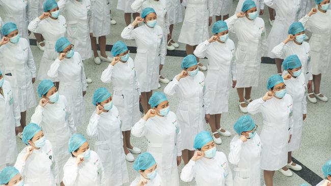 Nurses marking International Nurses Day in Wuhan. The city is amid a ten-day campaign to test all 11 million Wuhan residents following a new outbreak. Picture: AFP