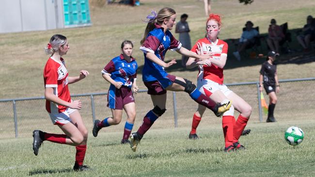 Action from the under 15/16 girls Queensland Christian Soccer Association grand final between Blackstone and Brisbane Valley. Picture: Gary Reid