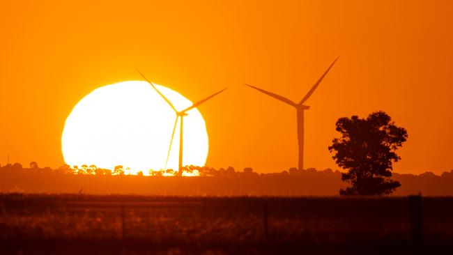 The sun sets behind wind turbines near Glenmore. Picture: Mark Stewart