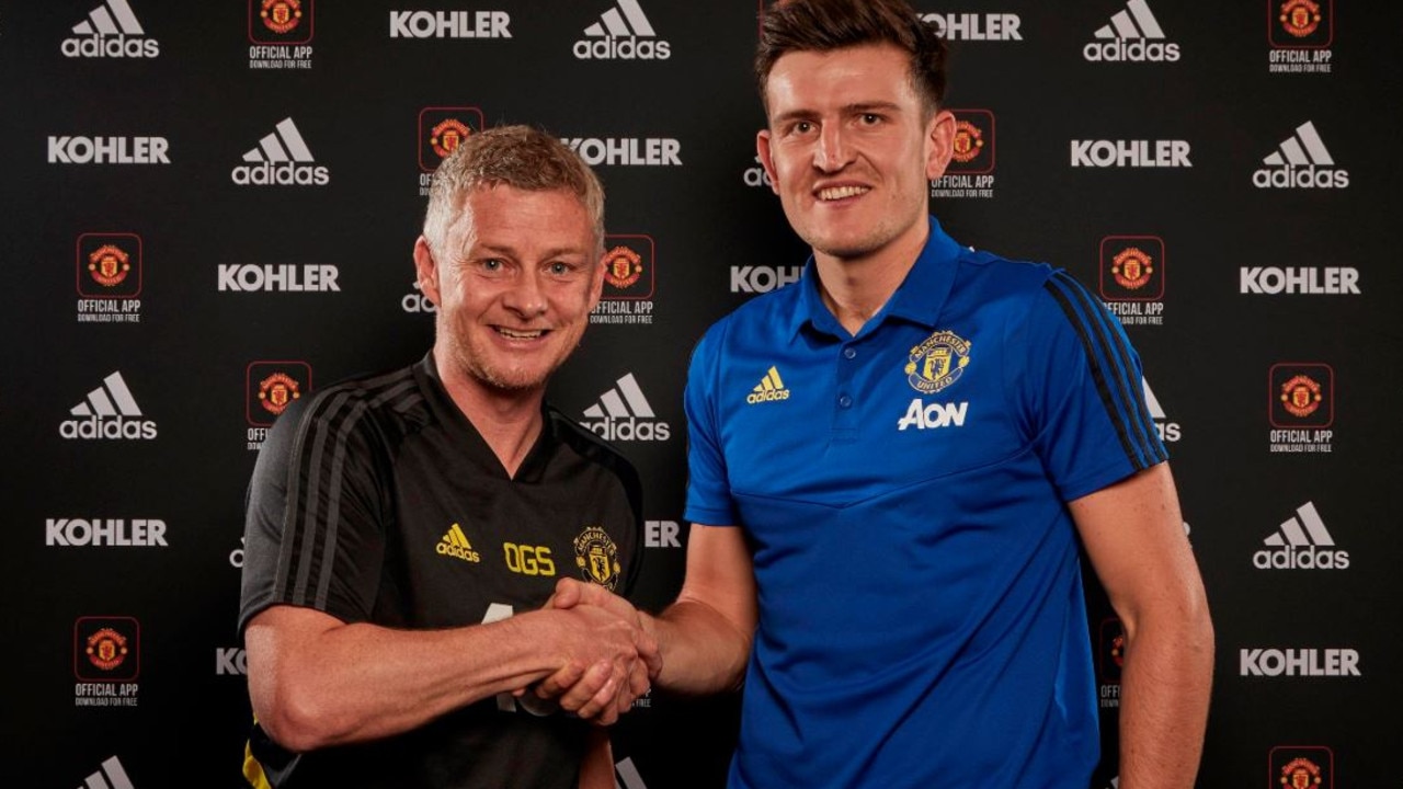 Harry Maguire with United manager Ole Gunnar Solskjaer. Picture: Manchester United