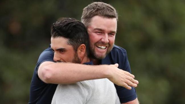 International pair Marc Leishman and Abraham Ancer after they combined to dramatically score a crucial half point at Royal Melbourne. Picture: Michael Klein