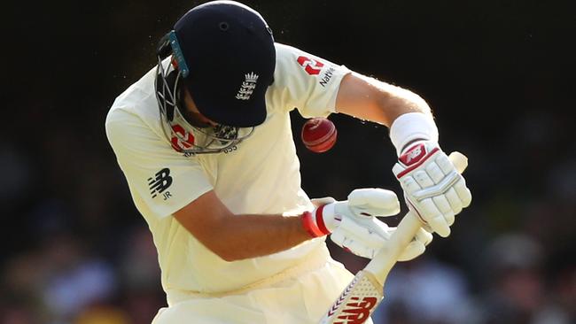 A Mitchell Starc bouncer cannons into Joe Root’s helmet.